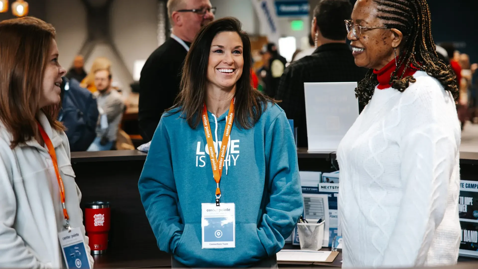 Picture of three Connection volunteers on a Sunday morning.